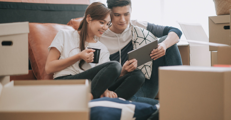 a young couple at home being cosy and comfortable