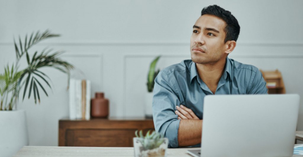 A man with his computer thinking